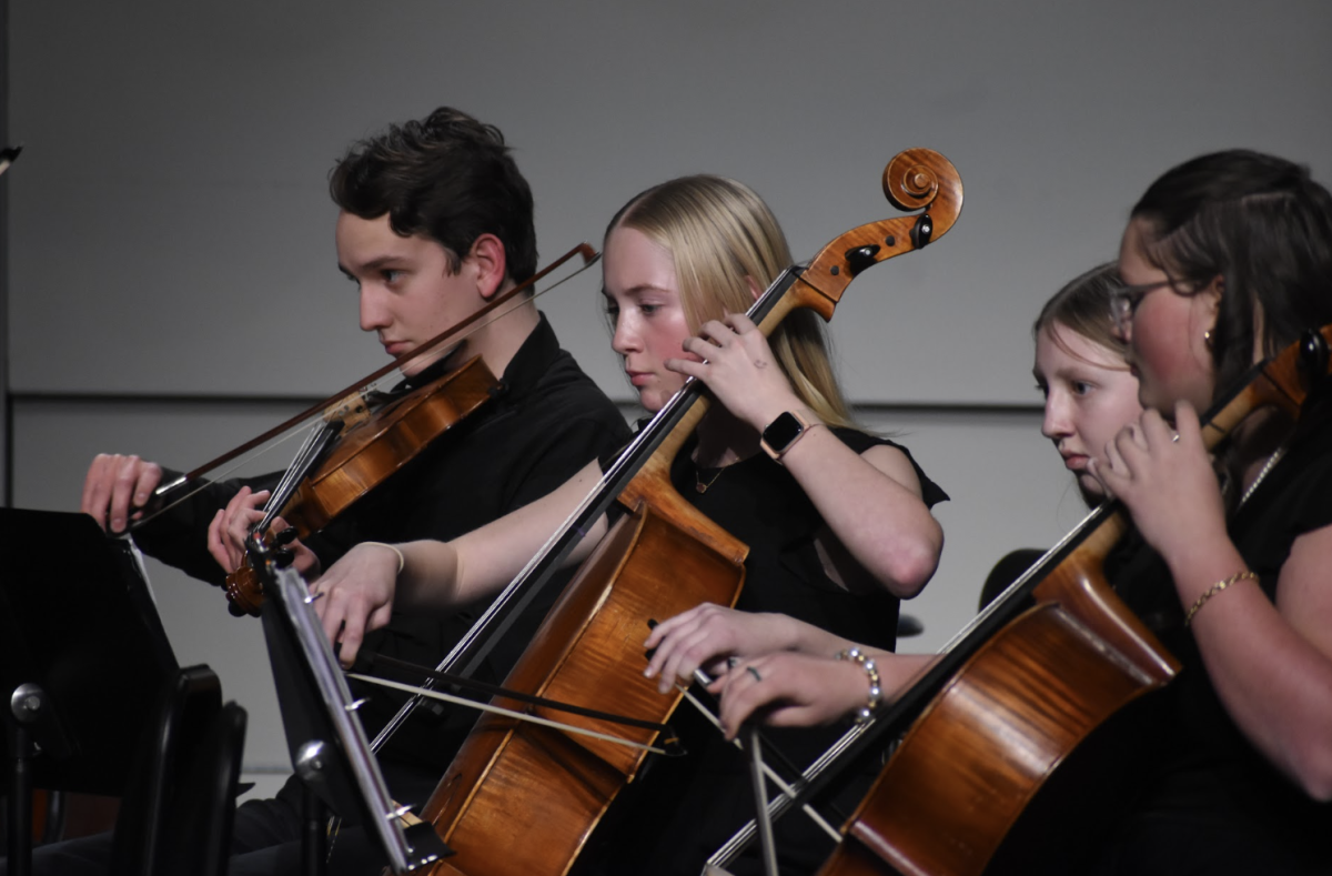 Roland Hensley (9), Elizabeth Krueger (9), Lila Trudel (9), and Isabella Carty (9) perform their instruments after practicing for the past quarter to perfect this performance. On December 5th, the strings department had a concert to show off their talents that they have been working very hard on. “I enjoy being able to showcase our hard work at the concert,” Krueger said, “I think it really reflects our dedication towards strings."